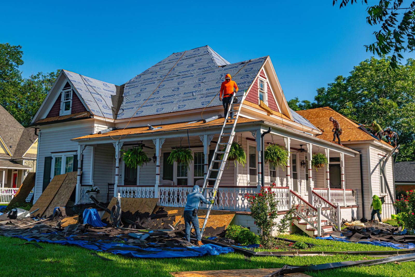 Roofers replacing the roof on an American home
